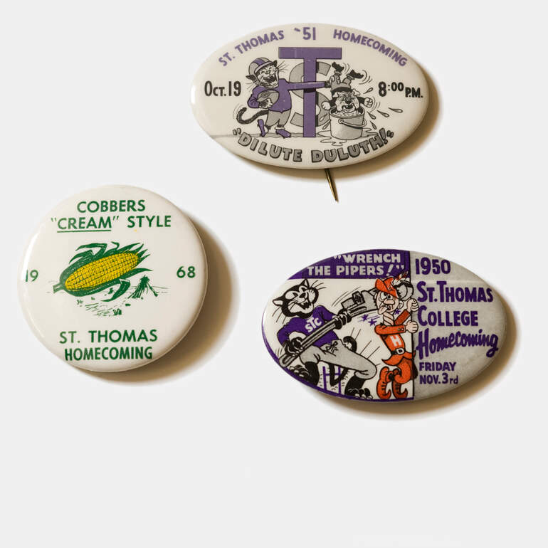 Three Homecoming pins from 1950, 1951, and 1968