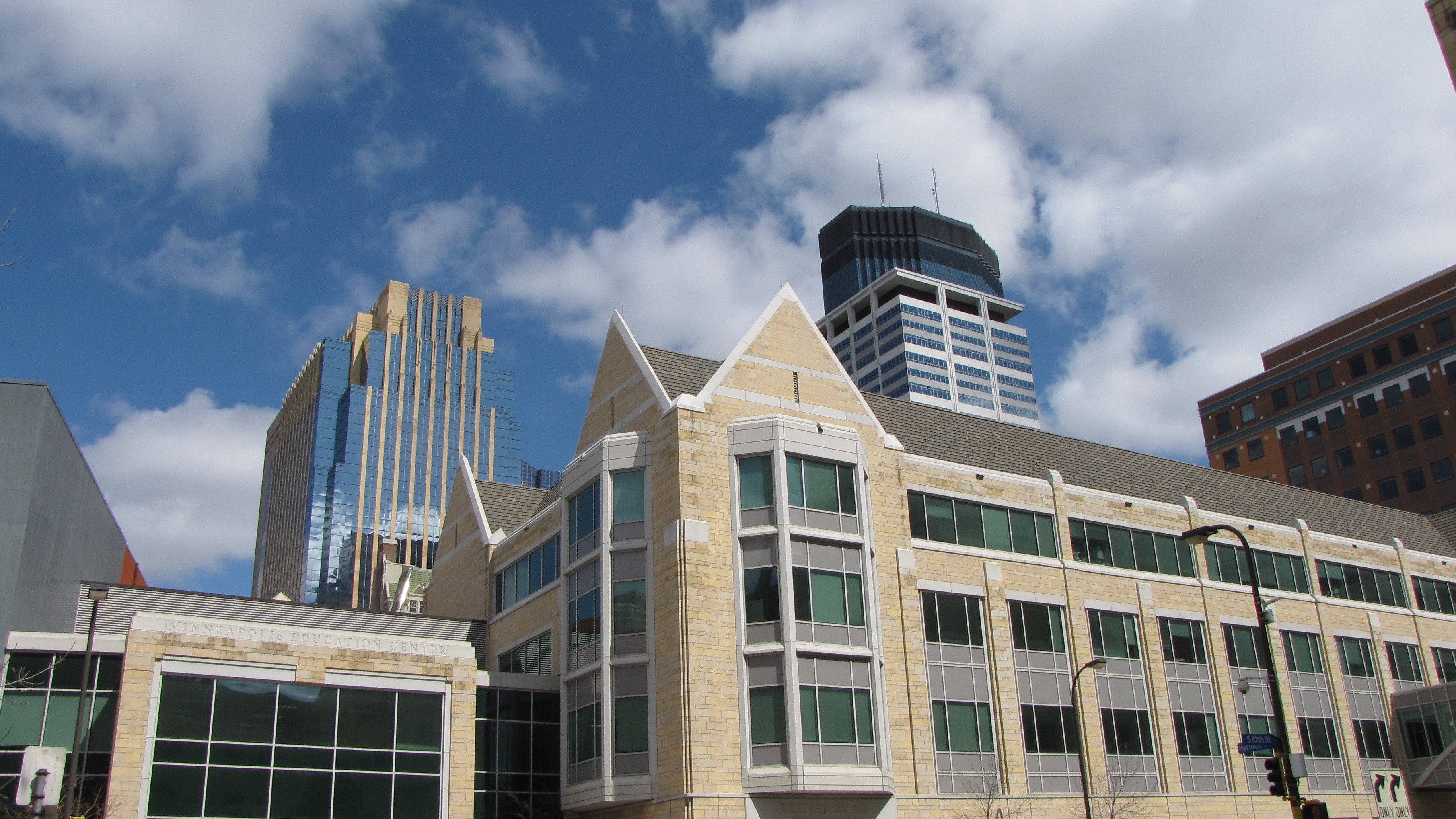 Exterior view of Opus Hall and the Minneapolis skyline