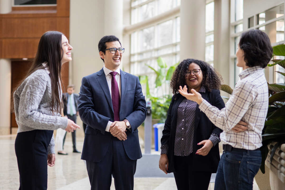 A group of law students converse