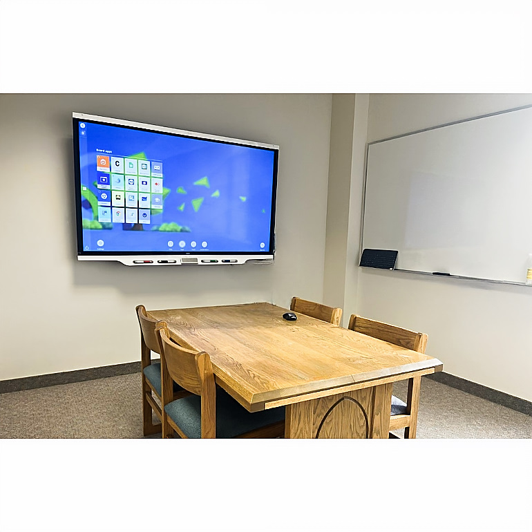 O'Shaughnnesy-Frey Library room 321 with table, SMART board and whiteboard