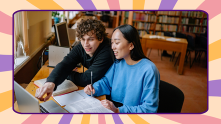 two students studying in a library